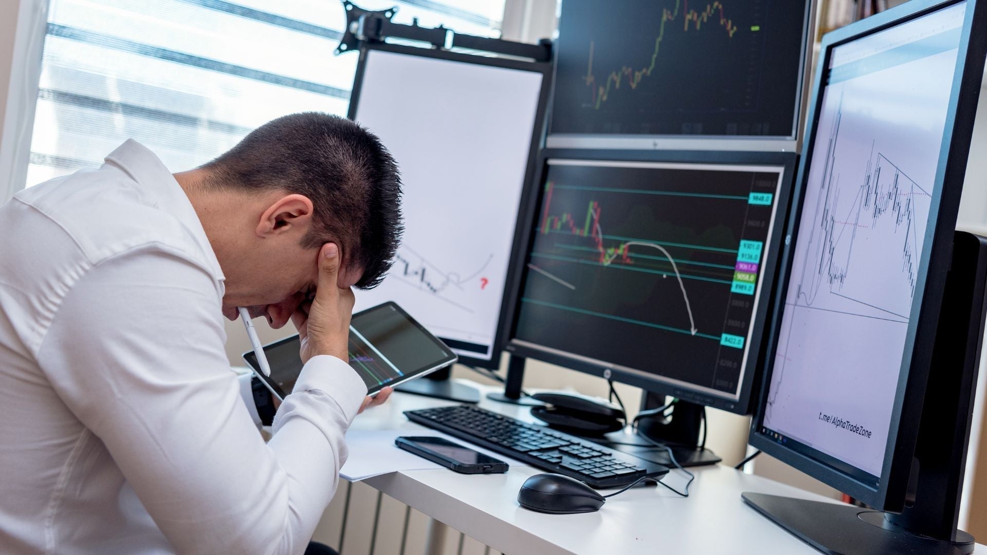 Office workers at computers with blood circulation diagrams